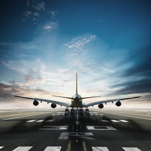 Huge two storeys commercial jetliner taking of runway. Modern and fastest mode of transportation. Dramatic sunset sky on background